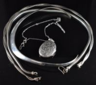 A c1900 silver locket with engraved foliate decoration, on silver chain, silver necklace made of
