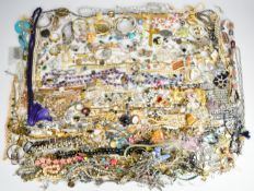 A collection of jewellery including vintage charm bracelet, faux pearls, gold plated necklace,