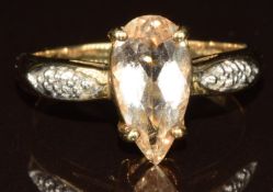 A 9k gold ring set with a pear cut imperial beryl and diamonds, size N