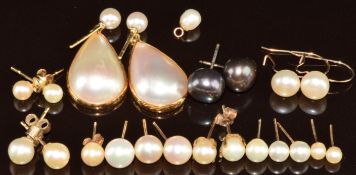 A pair of 18k gold earrings each set with a pearl and with a pear shaped pearl drop, four pairs of