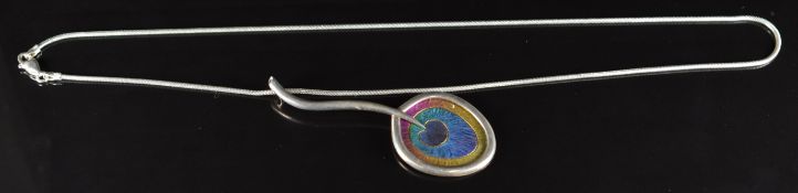 A silver pendant set with multi coloured niobium (6.5cm) on silver snake chain, made by James B