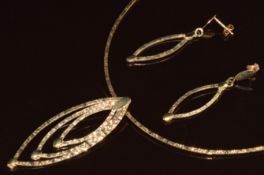 A 9ct gold necklace and matching earrings both made up of rectangular textured links, 12.2g