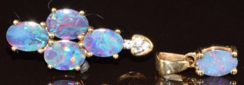 Two 9ct gold pendants, one set with crystal opal on ironstone and white zircons and the other an