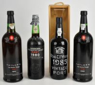 Four bottles of vintage Port comprising Cockburn's 1980, Royal Oporto 1983 and two Taylors 1991, all