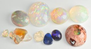 Seven loose opals including 11.1ct Welo opal, two synthetic opals, 8.1ct opal, 2.7ct black opal, a