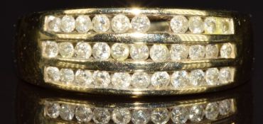 A 9ct gold ring set with three rows of diamonds (one missing), total 0.5ct, 3.8g, size M