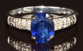 A 9k white gold ring set with an oval cut kyanite and white sapphires, 2.3g, size N