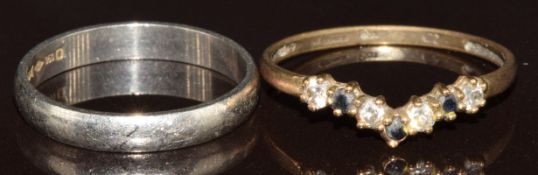 A 9ct gold 'V' shaped ring set with sapphires and cubic zirconia (0.9g, size O) and a platinum