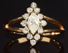 A 9ct gold ring set with marquise cut diamond of approximately 0.4ct surrounded by round cut