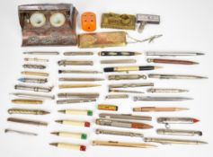 Japanese roll top inkwell, gilt metal coin case, large collection of pens and propelling pencils