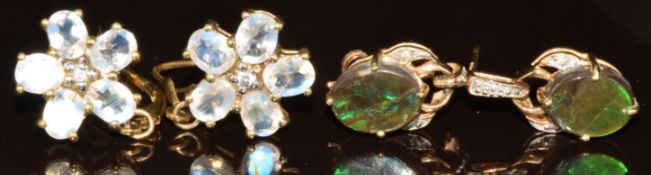 Two pairs of 9k gold earrings, one pair set with moonstones and the other pair ammolite and