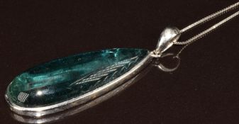 An 18k white gold pendant set with a tourmaline on 18k white gold chain, 10.9g