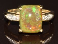 A 9ct gold ring set with an opal cabochon and diamonds, 4.1g, size N