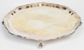 Elizabeth II hallmarked silver salver with shaped edge and raised on four scroll feet, Sheffield