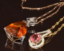 A 9k white gold pendant set with a trillion cut citrine and a diamond, and a 9ct gold pendant set