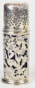 Victorian hallmarked silver sugar sifter with blue glass liner, embossed floral decoration and