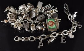 A silver charm bracelet with thirty charms including monkey in cage, whistle, St Christopher, car,