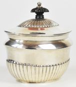 Victorian hallmarked silver tea caddy with reeded lower body and hinged lid, Sheffield 1898, maker