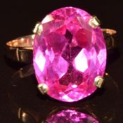 A 9ct gold ring set with an oval synthetic ruby, 4.7g, size P/Q