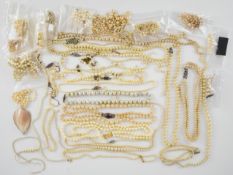 Five single strands of cultured pearl necklaces, four with silver clasps, together with a collection