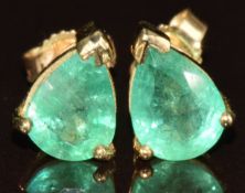 A pair of 9k gold earrings set with pear cut Socoto emeralds, total carat weight 1.5ct, with