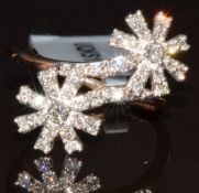 A 9k gold ring set with two clusters of diamonds from the Argyle mine, total diamond weight 0.5ct,