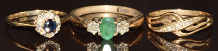 Three 9ct gold rings, one set with diamonds, one sapphire and diamond and the other emerald and