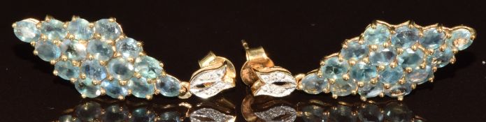 A pair of 9k gold earrings set with thirty- two oval cut Alexandrite totalling approximately 5.3ct