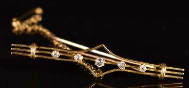 An 18ct gold brooch set with five round cut diamonds, 3.2g, 4.5cm