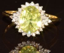 An 18k gold ring set with an oval cut Capelinha sphene of approximately 1.6ct surrounded by twenty