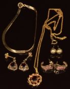 A 9ct gold ribbon bracelet, three pairs of 9ct gold earrings comprising one pair of studs, one set