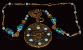 Ben Meltzer pendant necklace with phoenix decoration and glass beaded design