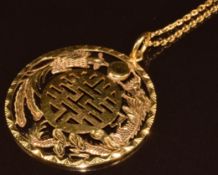 An 18ct gold pendant with dragon and phoenix decoration, on 18ct gold chain, 19.8g, 4cm, 66cm