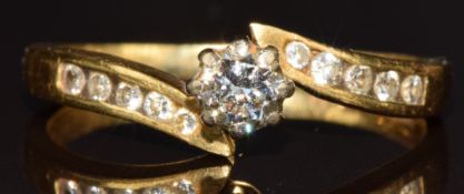 An 18ct gold ring set with diamonds, the centre diamond approximately 0.2ct, 2.5g, size K/L