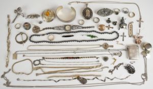 A collection of silver jewellery including bangle with bark effect, Victorian locket, ten brooches