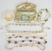 Freshwater pearl jewellery including four necklaces with silver clasps, a bracelet, a necklace