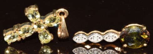Two 9k gold pendants, one set with Brazilian chrysoberyl in the form of a cross, with Gemporia
