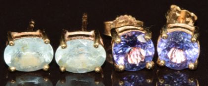 Two pairs of 9k gold earrings, one pair set with round cut tanzanites and the other oval cut paraiba