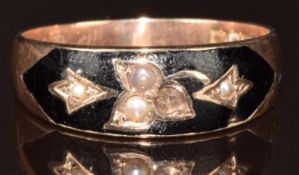 A 9ct gold ring set with black enamel and split pearls (one missing), Chester 1915, 3g, size Q
