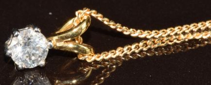 An 18ct gold pendant set with a round cut diamond of approximately 0.3ct, on 18ct gold chain, 3.
