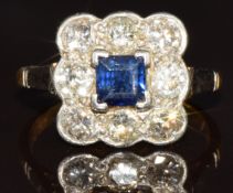 An 18ct gold ring set with a square cut sapphire of approximately 0.35ct surrounded by round cut