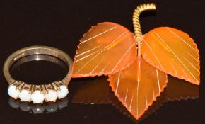 A 9ct gold ring set with five opal cabochons (2.8g, size O/P) and an amber brooch with yellow