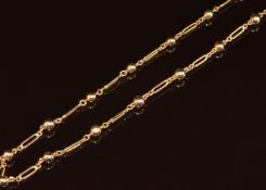 A 9ct gold necklace made up of spherical and elongated links, 13.3g, 66cm