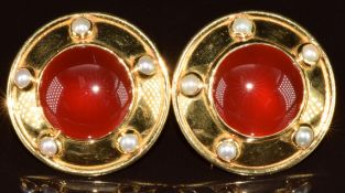 A pair of 18ct gold earrings each set with carnelian agate cabochon surrounded by split pearls, 19.