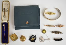 A collection of jewellery including two jet brooches, one with a locket compartment to the centre,