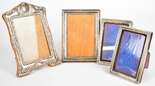 Four hallmarked silver photograph frames, the larger two to suit 6 x 4 inch photos, the smaller pair