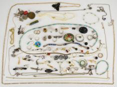 A collection of jewellery including glass beads, jet brooch, silver, mother of pearl and marcasite