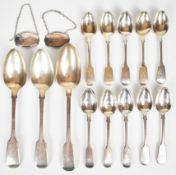 Georgian and Victorian hallmarked silver Fiddle pattern spoons comprising three table spoons and a