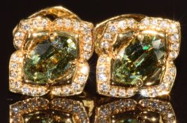 A pair of Kat Florence 18k gold earrings, each set with an oval step Russian cut demantoid garnet,