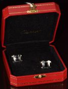 Cartier pair of silver cufflinks set with onyx, in original box